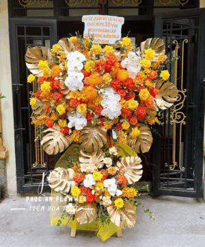 kệ hoa khai truong tông vàng 2 tầng cao cấp - Hoa Tươi Phúc An